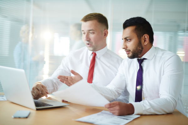 Business colleagues reviewing documents together